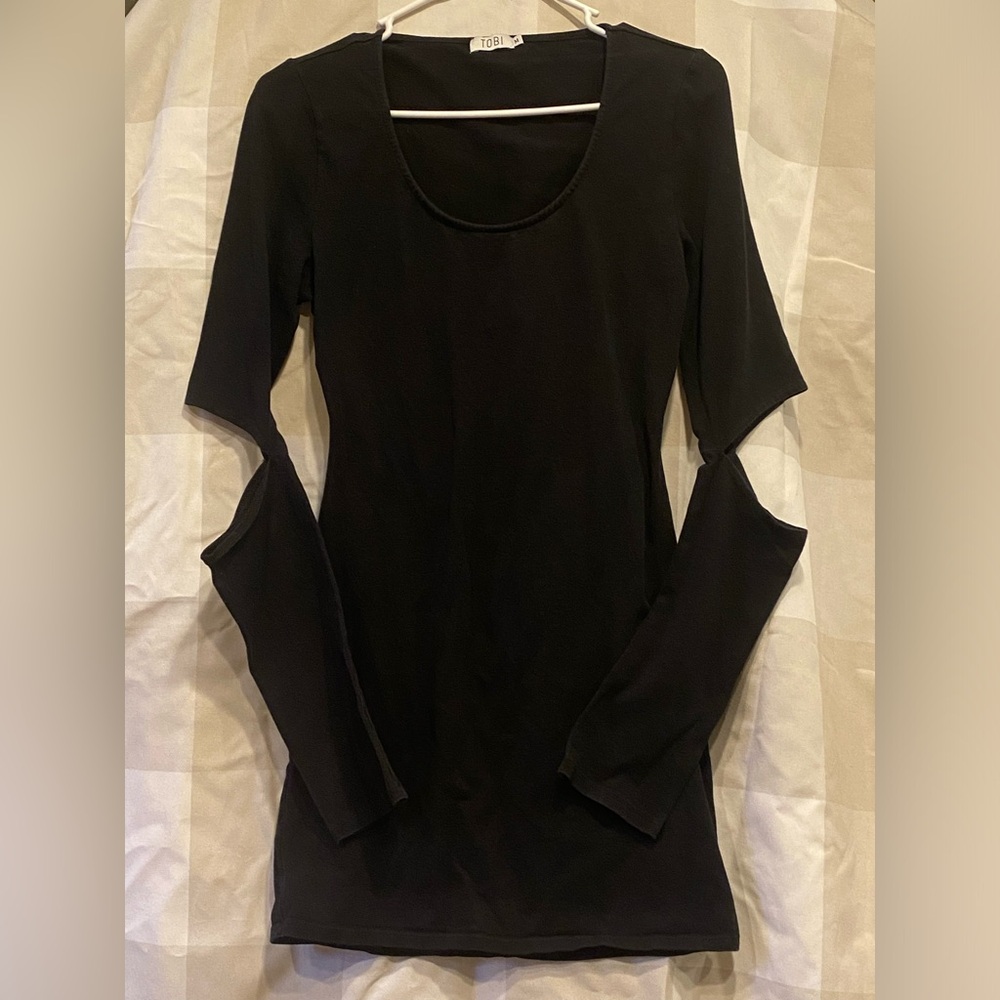 Tobi black long sleeved dress with cut out in back.